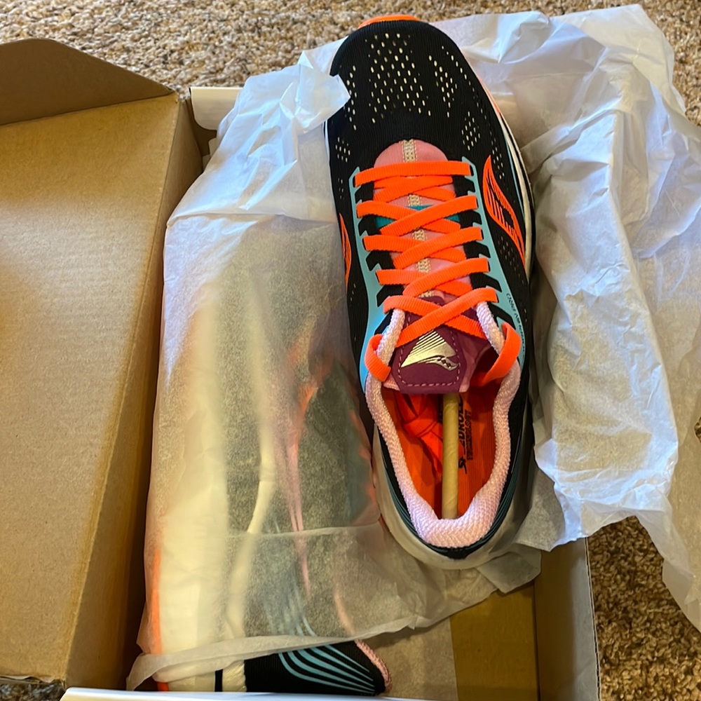 Brand new! Loved these shoes so I bought a 2nd pair. Running coach said no!